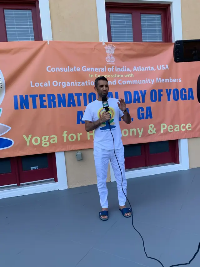 Dr. Somveer Arya addressing an International Day of Yoga gathering